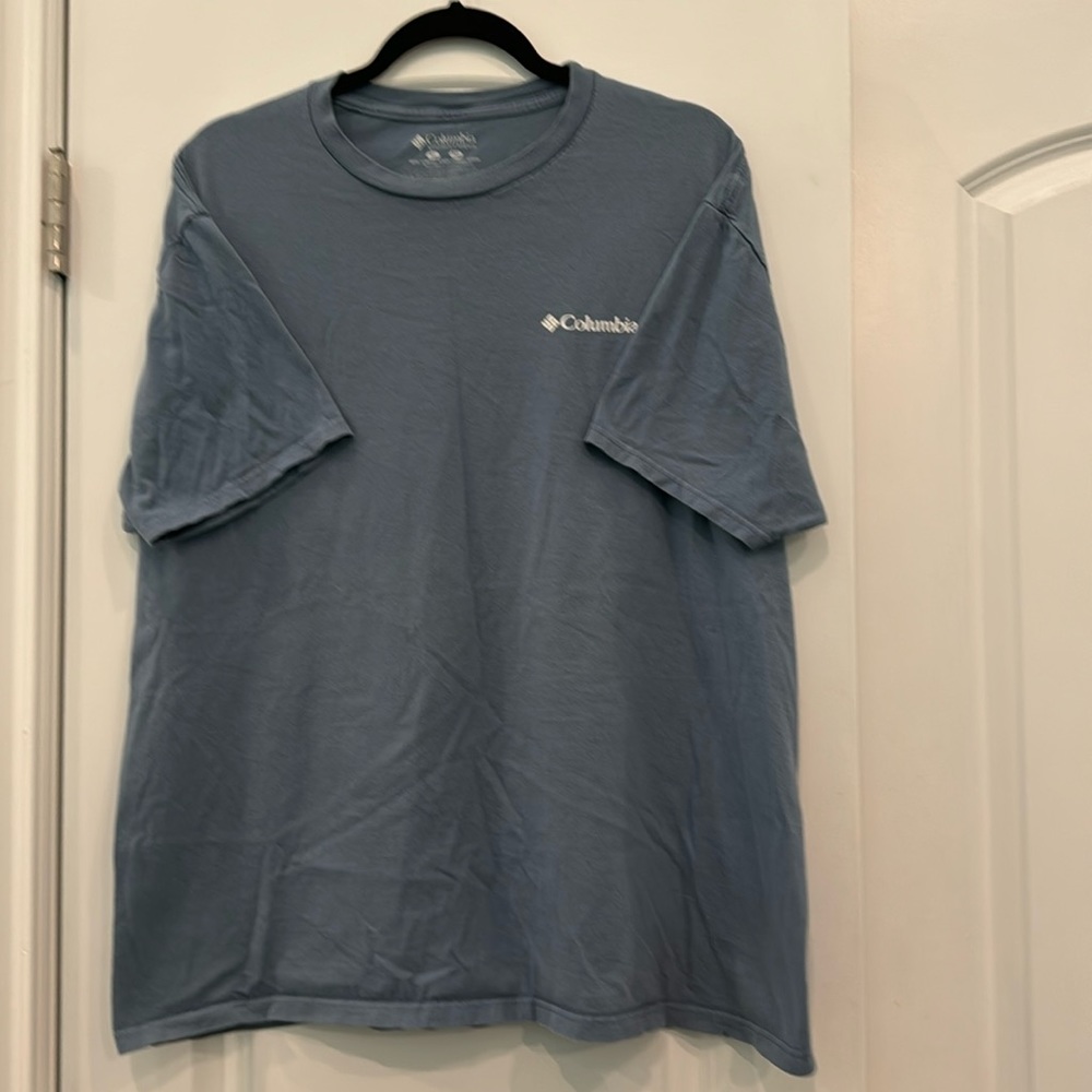 Columbia sportswear company short-sleeved t-shirt. Blue. Dog on back. Size XL.